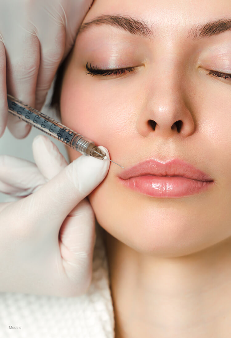 Woman getting injections above her lip line