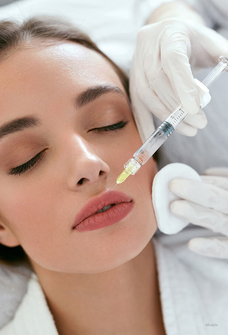 Woman getting injection on her lips